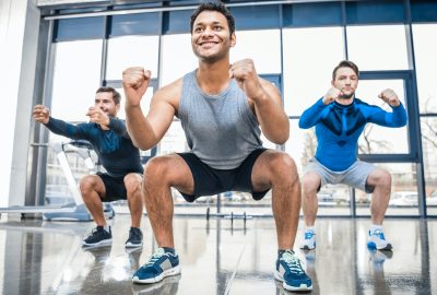 young men exercising at sports center